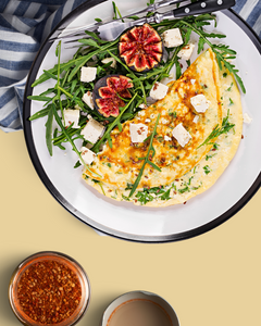 ROASTED GARLIC & SUN-DRIED TOMATO OMELETTE WITH GOAT CHEESE