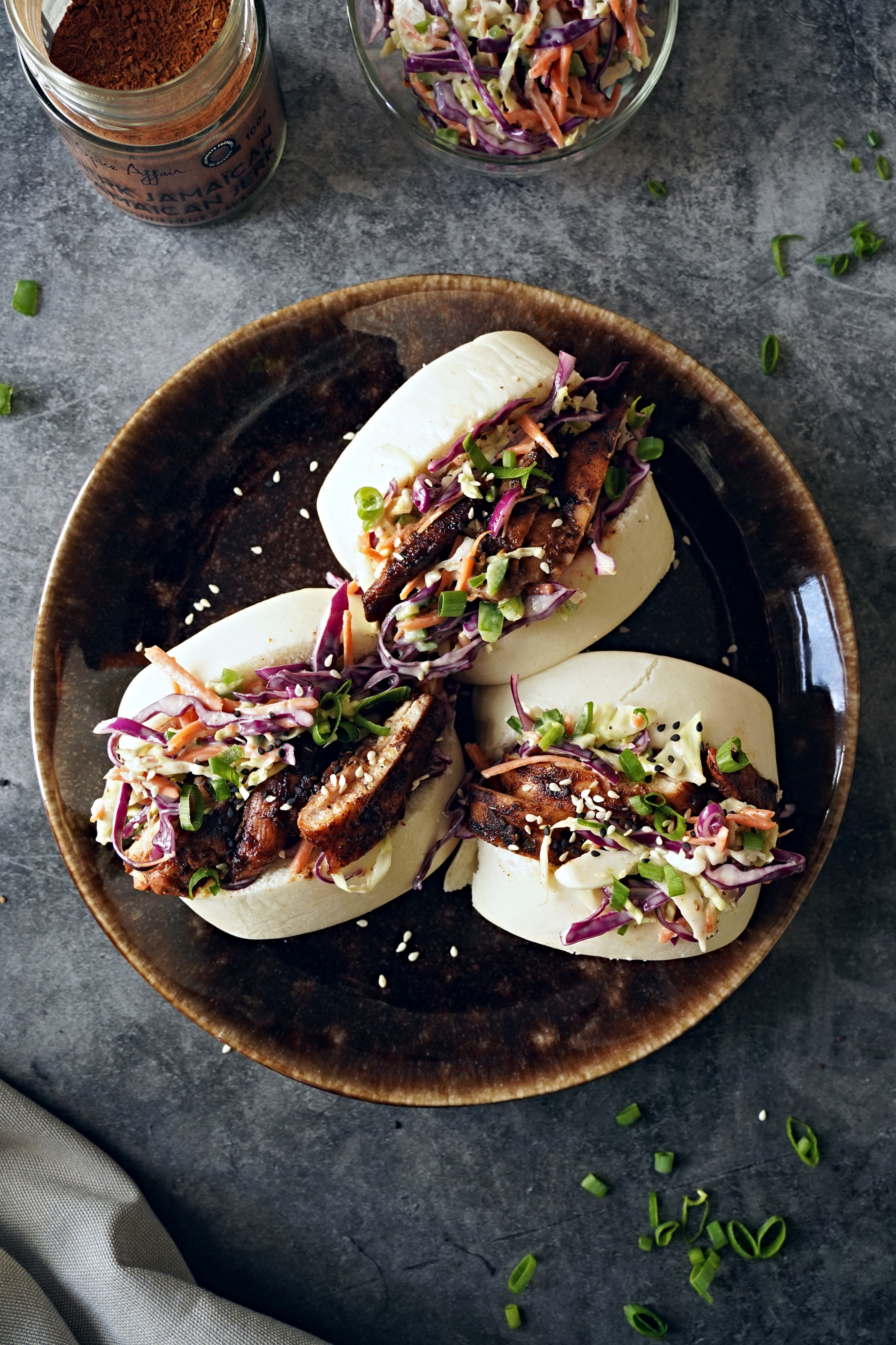 JERK CHICKEN BAOS WITH JALAPEÑO COLESLAW